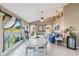 Dining area with canal views and contemporary decor, perfect for entertaining guests at 9317 Saint Paul Drive, Port Charlotte, FL 33981