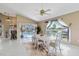 Bright dining area with water view and access to the pool at 9317 Saint Paul Drive, Port Charlotte, FL 33981