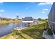 Waterfront property with boat dock featuring a covered lift, providing easy canal access at 9317 Saint Paul Drive, Port Charlotte, FL 33981