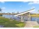 Well-maintained dock with boat lift, offering direct access to the tranquil canal waters at 9317 Saint Paul Drive, Port Charlotte, FL 33981