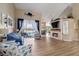 Open-concept living room with fireplace, backyard pool view, and high vaulted ceilings at 9317 Saint Paul Drive, Port Charlotte, FL 33981