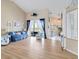 Bright living room featuring backyard views, coastal decor, and wood flooring at 9317 Saint Paul Drive, Port Charlotte, FL 33981
