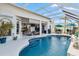 Backyard pool with an outdoor patio, kitchen and lounge seating at 9317 Saint Paul Drive, Port Charlotte, FL 33981