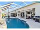 Inviting screened pool area with outdoor seating, perfect for relaxing and entertaining at 9317 Saint Paul Drive, Port Charlotte, FL 33981