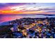 Aerial view of coastal town and beach at sunset at 9393 Midnight Pass Rd # 506, Sarasota, FL 34242