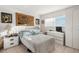 Bright bedroom featuring neutral colored walls, a window and tile floor at 9393 Midnight Pass Rd # 506, Sarasota, FL 34242