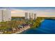 Condo complex along the water featuring a kayak launch and car parking at 9393 Midnight Pass Rd # 506, Sarasota, FL 34242