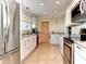 Well-lit kitchen featuring stainless steel appliances and granite countertops at 9393 Midnight Pass Rd # 506, Sarasota, FL 34242