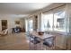 Dining area with table, chairs, and a view of the well lit open floorplan at 965 N Boundry Road, Englewood, FL 34223