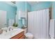 This bathroom features a shower with neutral tile and a framed glass door at 9847 Hawk Nest Ln, North Port, FL 34287