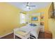 Cozy bedroom features a built in wall unit and a ceiling fan at 9847 Hawk Nest Ln, North Port, FL 34287