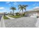 Well-maintained home with a brick driveway and manicured landscaping at 9847 Hawk Nest Ln, North Port, FL 34287