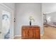 Inviting entryway featuring a charming cabinet and decorative details, welcoming guests into the home at 9847 Hawk Nest Ln, North Port, FL 34287