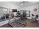 Well-equipped fitness center featuring treadmills, weight machines, and mirrors at 9847 Hawk Nest Ln, North Port, FL 34287