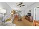 Comfortable living room with tile floors, open floorplan, and ample seating at 9847 Hawk Nest Ln, North Port, FL 34287