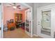 Cozy office space with french doors for privacy, filled with a bookcase and plenty of decor at 9847 Hawk Nest Ln, North Port, FL 34287