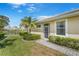 Image shows a well-maintained exterior with a view of the adjacent pond and lush green lawn at 9847 Hawk Nest Ln, North Port, FL 34287