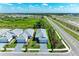 Aerial view of homes with manicured lawns and landscaping in a well-planned community at 995 Waterline Ct, Sarasota, FL 34240