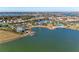 Aerial view of waterfront community with stunning lake views, luxurious amenities, and beautiful landscaping at 995 Waterline Ct, Sarasota, FL 34240