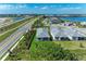 Aerial view of new homes in a community featuring lush landscaping and a scenic waterfront at 995 Waterline Ct, Sarasota, FL 34240