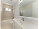 Bright bathroom featuring a vanity, shower, tub, and large mirror, perfect for modern living at 995 Waterline Ct, Sarasota, FL 34240