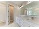 Bathroom with double sink vanity, granite countertops, and ample cabinet space at 995 Waterline Ct, Sarasota, FL 34240