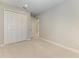 Cozy bedroom featuring carpet, double-door closet, and neutral paint to allow for easy personalization at 995 Waterline Ct, Sarasota, FL 34240