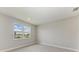 Bedroom with a large window offering natural light and a view at 995 Waterline Ct, Sarasota, FL 34240