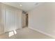 Cozy bedroom with plush carpeting, a double-door closet, and fresh, neutral paint at 995 Waterline Ct, Sarasota, FL 34240