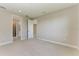 Spacious bedroom with neutral carpet and access to the ensuite bathroom and walk-in closet at 995 Waterline Ct, Sarasota, FL 34240