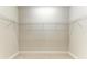 A large walk-in closet with white walls and metal shelving, ready for storage and organization at 995 Waterline Ct, Sarasota, FL 34240