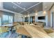 Community game room featuring ample tables with chairs and a television at 995 Waterline Ct, Sarasota, FL 34240