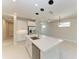 An island kitchen with stainless steel appliances and a tile floor at 995 Waterline Ct, Sarasota, FL 34240