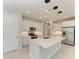 An island kitchen with stainless steel appliances and a tile floor at 995 Waterline Ct, Sarasota, FL 34240