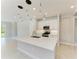An island kitchen with stainless steel appliances and a tile floor at 995 Waterline Ct, Sarasota, FL 34240