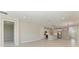 Open-concept living area with tile flooring, kitchen, and a view to backyard at 995 Waterline Ct, Sarasota, FL 34240