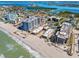 Aerial view showcasing Lido Towers condos with surrounding cityscape and ocean views at 1001 Benjamin Franklin Dr # 510, Sarasota, FL 34236