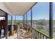 Enjoy the view from this screened balcony with a dining and seating area at 1001 Benjamin Franklin Dr # 510, Sarasota, FL 34236