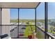 Relax on this screened balcony offering neighborhood views at 1001 Benjamin Franklin Dr # 510, Sarasota, FL 34236