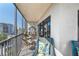 Serene screened balcony with comfortable seating and scenic views at 1001 Benjamin Franklin Dr # 510, Sarasota, FL 34236