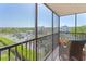 Relaxing screened balcony with seating and lovely views at 1001 Benjamin Franklin Dr # 510, Sarasota, FL 34236
