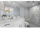 Modern bathroom featuring a glass-enclosed shower and marble countertops at 1001 Benjamin Franklin Dr # 510, Sarasota, FL 34236