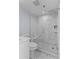 Elegant bathroom with a glass shower, marble tile, and modern fixtures at 1001 Benjamin Franklin Dr # 510, Sarasota, FL 34236