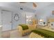 Cozy bedroom featuring twin beds with yellow checkered bedding and a ceiling fan at 1001 Benjamin Franklin Dr # 510, Sarasota, FL 34236