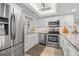Bright kitchen with stainless steel appliances and granite countertops, perfect for cooking and entertaining at 1001 Benjamin Franklin Dr # 510, Sarasota, FL 34236