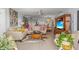Bright living room with modern furnishings, open layout, and access to a dining area at 1001 Benjamin Franklin Dr # 510, Sarasota, FL 34236