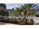 Resort-style pool area surrounded by lush tropical foliage and lounge chairs for ultimate relaxation at 1001 Benjamin Franklin Dr # 510, Sarasota, FL 34236
