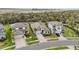 An aerial view of single-Gathering homes, showcasing manicured lawns and lush landscaping at 10179 Milky Way Cir, Sarasota, FL 34241