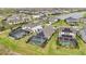 Neighborhood aerial view highlighting the pools, screened lanais, manicured lawns, and community ponds at 10179 Milky Way Cir, Sarasota, FL 34241
