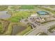 Aerial view of community sports park with soccer fields, baseball diamonds, tennis courts and walking paths at 10179 Milky Way Cir, Sarasota, FL 34241